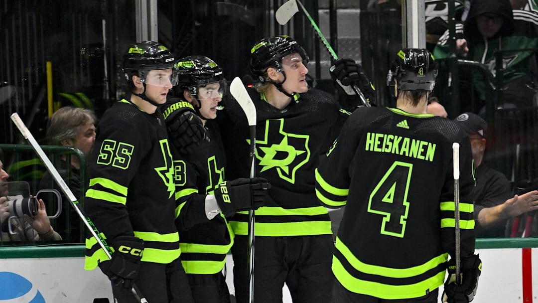 Jan 27, 2024; Dallas, Texas, USA; Dallas Stars defenseman Thomas Harley (55) and center Wyatt Johnston (53) and center Roope Hintz (24) and defenseman Miro Heiskanen (4) celebrates a goal scored by Johnston against the Washington Capitals during the first period at the American Airlines Center. Mandatory Credit: Jerome Miron-Imagn Images