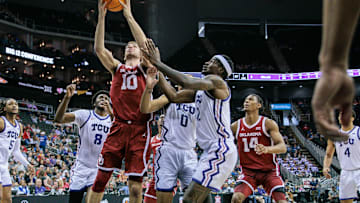 Mar 13, 2024; Kansas City, MO, USA; Oklahoma Sooners forward Sam Godwin (10) rebounds the ball during the second half against the TCU Horned Frogs at T-Mobile Center. Mandatory Credit: William Purnell-Imagn Images