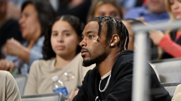 Jun 2, 2024; Fort Worth, Texas, USA; Chicago Bears safety Jonathan Owens watches his wife Simone Biles (not pictured) as she performs during day two of the women’s 2024 Xfinity U.S. Gymnastics Championships at Dickies Arena.