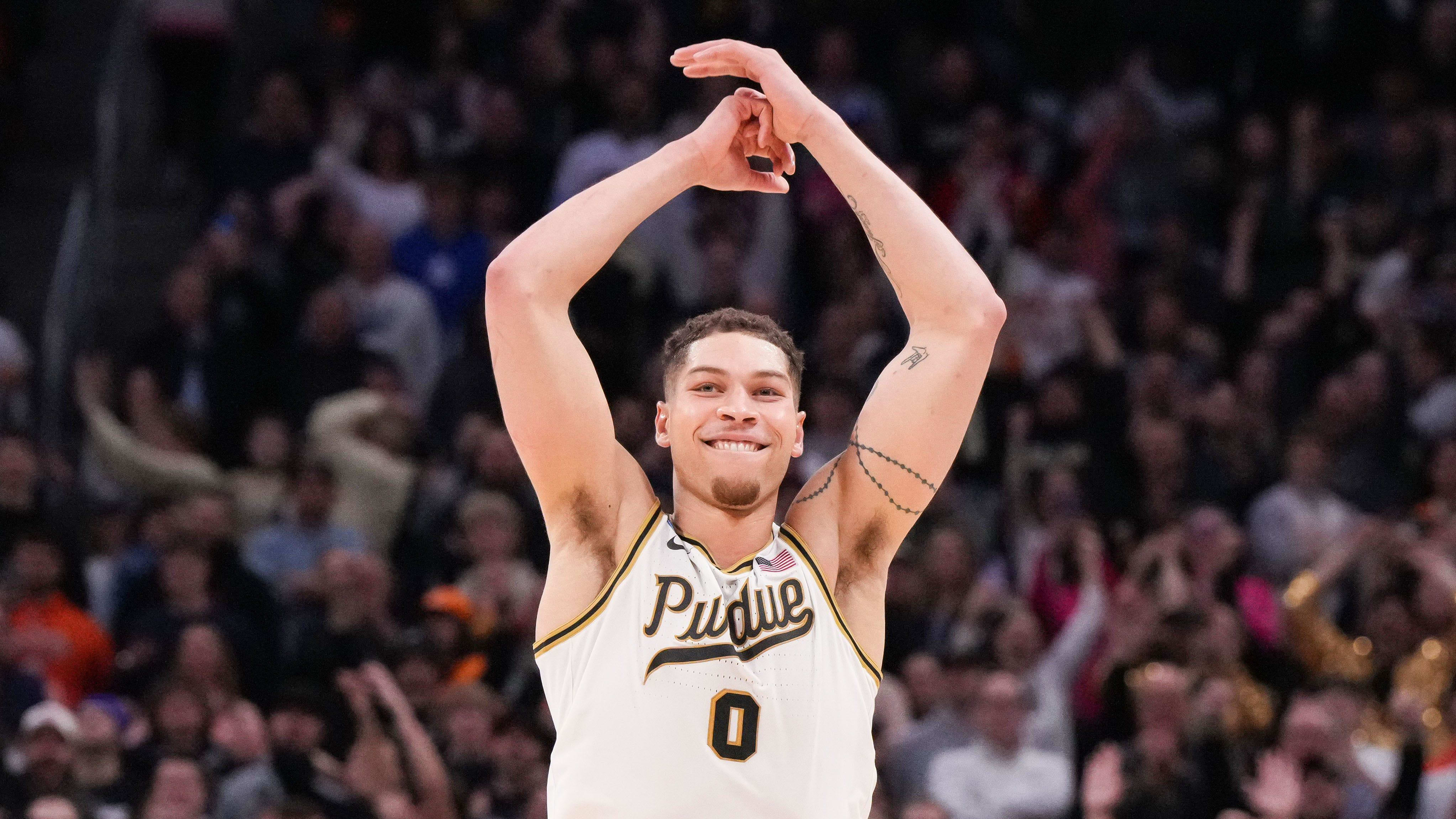 Purdue Boilermakers forward Mason Gillis (0) throws his hands in the air to celebrate Sunday