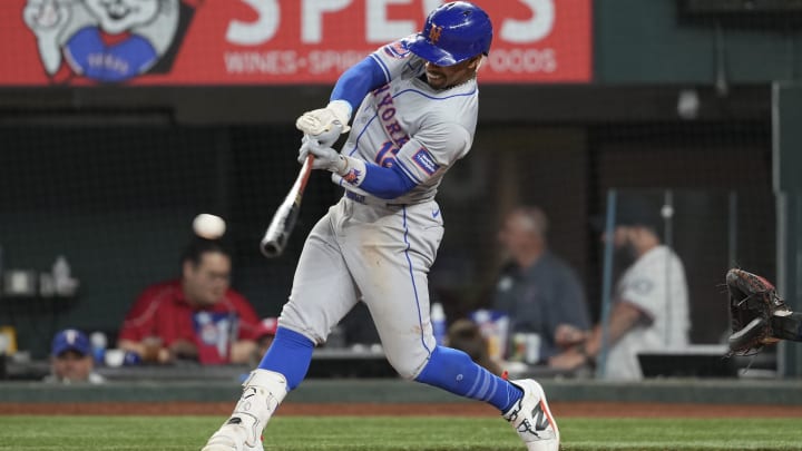 Jun 17, 2024; Arlington, Texas, USA; New York Mets shortstop Francisco Lindor (12) connects for an RBI double against the Texas Rangers during the fifth inning at Globe Life Field. Mandatory Credit: Jim Cowsert-USA TODAY Sports Jun 17, 2024; Arlington, Texas, USA; New York Mets shortstop Francisco Lindor (12) connects for an RBI double against the Texas Rangers during the fifth inning at Globe Life Field. Mandatory Credit: Jim Cowsert-USA TODAY Sports