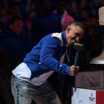 Oct 22, 2022; Philadelphia, Pennsylvania, USA;  Philadelphia Eagles quarterback Jalen Hurts rings the bell before the game between the Philadelphia 76ers and the San Antonio Spurs at Wells Fargo Center. Mandatory Credit: John Geliebter-Imagn Images