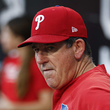 Jul 28, 2025; Chicago, Illinois, USA; Philadelphia Phillies manager Rob Thomson (59) looks on from the dugout before a baseball game against the Chicago White Sox at Rate Field. 