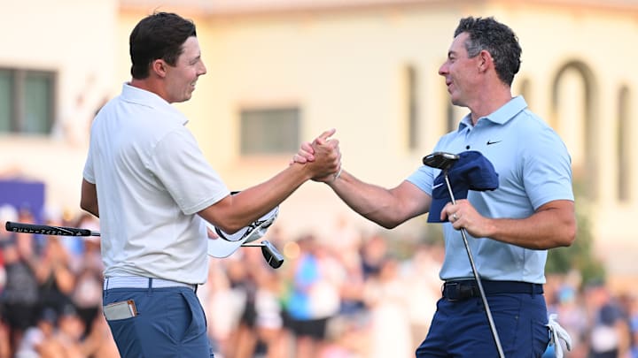Matt Fitzpatrick and Rory McIlroy shake hands on the 18th green following the playoff at the 2025 DP World Tour Championship.