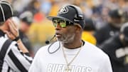 Nov 8, 2025; Morgantown, West Virginia, USA; Colorado Buffaloes head coach Deion Sanders walks along the sidelines late in the fourth quarter against the West Virginia Mountaineers at Milan Puskar Stadium. Mandatory Credit: Ben Queen-Imagn Images