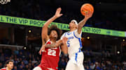 Feb 9, 2025; Memphis, Tennessee, USA; Memphis Tigers guard Dante Harris (5) shoots the ball against Temple Owls forward Elijah Gray (22), who transferred to the Wisconsin Badgers.
