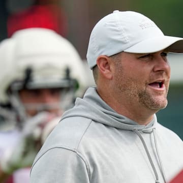 July 30, 2025; Tuscaloosa, AL, USA; Defensive coordinator Kane Wommack watches linebackers run drill sduring the first practice session of the preseason for the Alabama Crimson Tide.