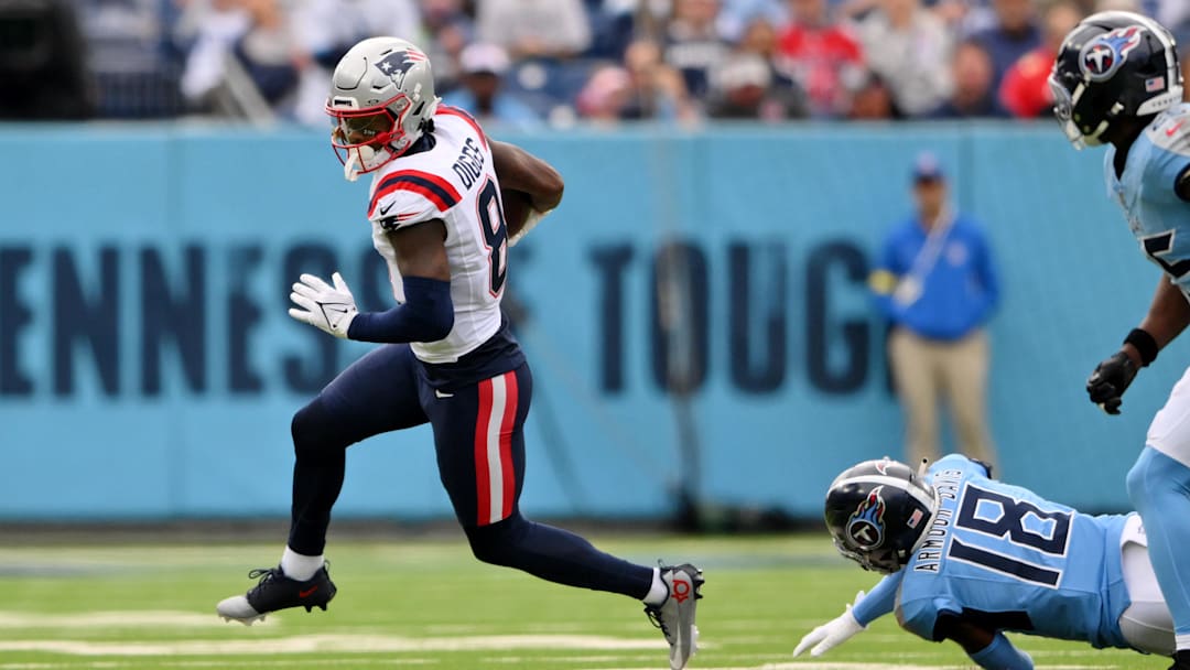 Oct 19, 2025; Nashville, Tennessee, USA; New England Patriots wide receiver Stefon Diggs (8) runs with the ball against the Tennessee Titans during the first half at Nissan Stadium. Mandatory Credit: Steve Roberts-Imagn Images