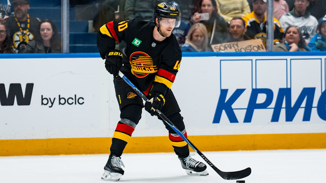 Jan 3, 2026; Vancouver, British Columbia, CAN; Vancouver Canucks forward Elias Pettersson (40) handles the puck against the Boston Bruins in the second period at Rogers Arena. Mandatory Credit: Bob Frid-Imagn Images