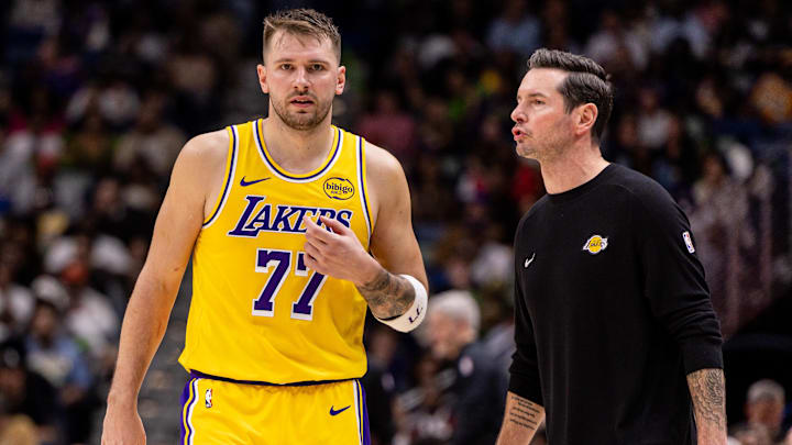 Los Angeles Lakers forward/guard Luka Doncic (77) talks to Head Coach JJ Redick.