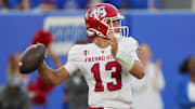 Aug 23, 2025; Lawrence, Kansas, USA; Fresno State Bulldogs quarterback E.J. Warner (13) throws a pass during the first half against the Kansas Jayhawks at David Booth Kansas Memorial Stadium. Mandatory Credit: Jay Biggerstaff-Imagn Images