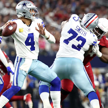Dallas Cowboys quarterback Dak Prescott looks to pass against the Arizona Cardinals in the second half.