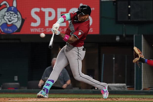 Marte with a three-run homer in grey pants and a red jersey with a black helme