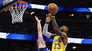 Mar 24, 2025; Orlando, Florida, USA; Los Angeles Lakers forward LeBron James (23) drives to the basket against the Orlando Magic in the second quarter at Kia Center. Mandatory Credit: Nathan Ray Seebeck-Imagn Images