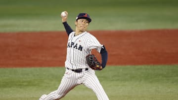 Aug 4, 2021; Yokohama, Japan; Team Japan pitcher Yoshinobu Yamamoto (17) throws a pitch against