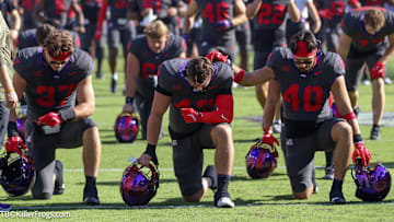 TCU Players in Prayer before game