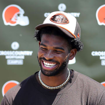 Cleveland Browns quarterback Shedeur Sanders (12) jokes about his signing bonus during a press conference before day two of NFL rookie minicamp at the Cleveland Browns training facility on Saturday, May 10, 2025, in Berea, Ohio.
