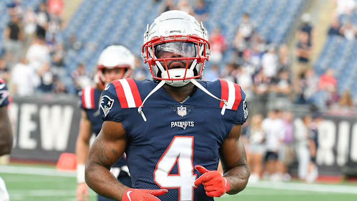 Aug 11, 2022; Foxborough, Massachusetts, USA; New England Patriots cornerback Malcolm Butler (4) warms up before a preseason game against the New York Giants at Gillette Stadium. Mandatory Credit: Eric Canha-Imagn Images