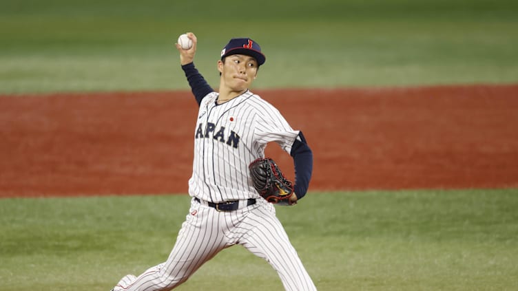 Aug 4, 2021; Yokohama, Japan; Team Japan pitcher Yoshinobu Yamamoto (17) throws a pitch against