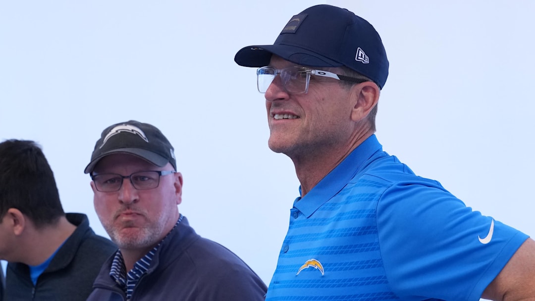 January 27, 2026; El Segundo, California, USA; Los Angeles Chargers coach Jim Harbaugh (right) and general manager Joe Hortiz attend introductory press conference for offensive coordinator Mike McDaniel at The Bolt. Mandatory Credit: Kirby Lee-Imagn Images