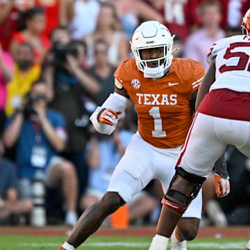 Oct 11, 2025; Dallas, Texas, USA; Oklahoma Sooners offensive lineman Michael Fasusi (56) blocks Texas Longhorns defensive end Colin Simmons (1) during the game between the Texas Longhorns and the Oklahoma Sooners at the Cotton Bowl. Mandatory Credit: Jerome Miron-Imagn Images