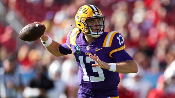 Jan 1, 2024; Tampa, FL, USA;  LSU Tigers quarterback Garrett Nussmeier (13) throws a pass against the Wisconsin Badgers in the third quarter during the ReliaQuest Bowl at Raymond James Stadium. Mandatory Credit: Nathan Ray Seebeck-USA TODAY Sports