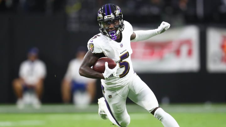 Sep 13, 2021; Paradise, Nevada, USA; Baltimore Ravens wide receiver Marquise Brown (5) runs the ball against the Las Vegas Raiders during the first half at Allegiant Stadium. Mandatory Credit: Mark J. Rebilas-USA TODAY Sports