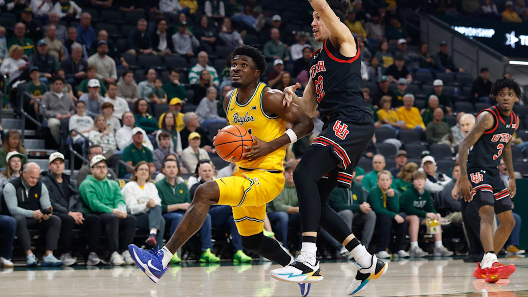 Mar 7, 2026; Waco, Texas, USA;  Baylor Bears guard Tounde Yessoufou (24) drives to the basket ahead of Utah Utes forward James Okonkwo (32) during the first half at Paul and Alejandra Foster Pavilion. Mandatory Credit: Chris Jones-Imagn Images