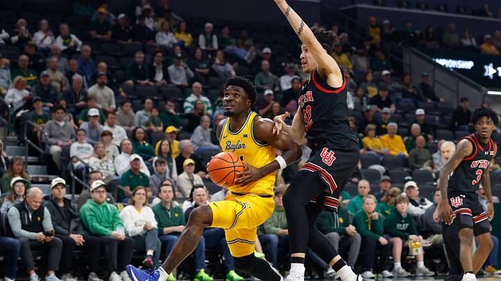 Mar 7, 2026; Waco, Texas, USA;  Baylor Bears guard Tounde Yessoufou (24) drives to the basket ahead of Utah Utes forward James Okonkwo (32) during the first half at Paul and Alejandra Foster Pavilion. Mandatory Credit: Chris Jones-Imagn Images