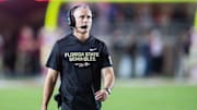 Florida State Seminoles head coach Mike Norvell walks down the field. The Miami Hurricanes lead the Florida State Seminoles 14-3 at the half on Saturday, Oct. 4, 2025.