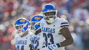 Nov 8, 2025; Tucson, Arizona, USA; Kansas Jayhawks defensive end Leroy Harris III (33) against the Arizona Wildcats at Arizona Stadium. Mandatory Credit: Mark J. Rebilas-Imagn Images