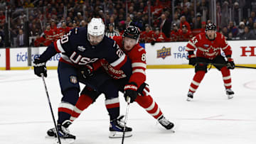 Feb 20, 2025; Boston, MA, USA; [Imagn Images direct customers only]  Team USA forward Chris Kreider (20) holds back Team Canada defenseman Cale Makar (8) during the third period during the 4 Nations Face-Off ice hockey championship game at TD Garden. 
