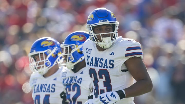 Nov 8, 2025; Tucson, Arizona, USA; Kansas Jayhawks defensive end Leroy Harris III (33) against the Arizona Wildcats at Arizona Stadium. Mandatory Credit: Mark J. Rebilas-Imagn Images