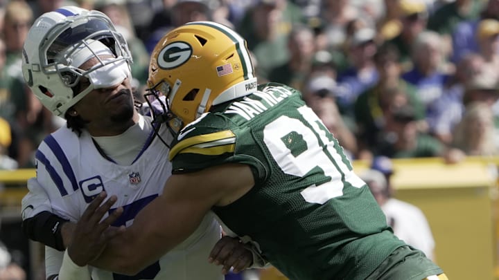 Green Bay Packers defensive end Lukas Van Ness (90) is called for roughing the pass on Indianapolis Colts quarterback Anthony Richardson (5) during the second quarter at Lambeau Field.