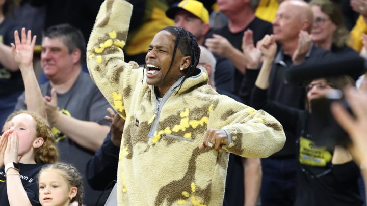 Mar 3, 2024; Iowa City, Iowa, USA; American rapper, singer, songwriter, and record producer Travis Scott watches the game between the Iowa Hawkeyes and the Ohio State Buckeyes during the second half at Carver-Hawkeye Arena. Mandatory Credit: Reese Strickland-USA TODAY Sports