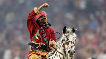 Dec 29, 2022; Orlando, Florida, USA; Florida State Seminoles Chief Osceola and horse Renegade entertain the crowd before the 2022 Cheez-It Bowl against the Oklahoma Sooners at Camping World Stadium. Mandatory Credit: Nathan Ray Seebeck-Imagn Images