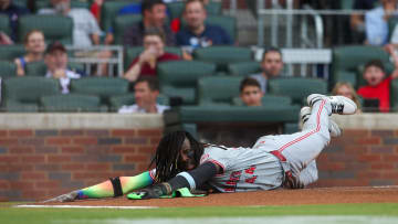 Jul 22, 2024; Atlanta, Georgia, USA; Cincinnati Reds shortstop Elly De La Cruz (44) reacts after scoring a run against the Atlanta Braves in the first inning at Truist Park. Mandatory Credit: Brett Davis-USA TODAY Sports