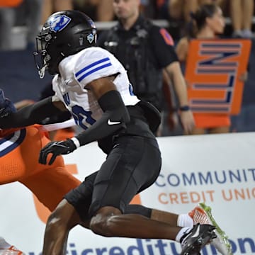 Aug 29, 2024; Champaign, Illinois, USA; Illinois Fighting Illini wide receiver Pat Bryant (13) scores a touchdown on a pass in front of Eastern Illinois Panthers defensive back Allen Brown III (30) during the first half at Memorial Stadium. Mandatory Credit: Ron Johnson-Imagn Images