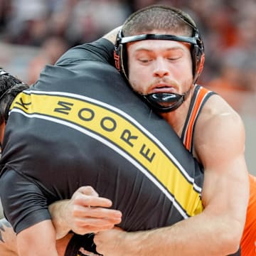Oklahoma State’s Reece Witcraft takes down Missouri’s Kade Moore during an NCAA wrestling meet between Oklahoma State and Missouri at Gallagher-Iba Arena in Stillwater, Okla., on Sunday, Feb. 2, 2025.