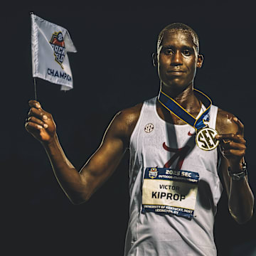 Victor Kiprop with SEC championship medal in the 10,000m race