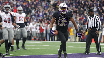 Nov 29, 2013; Seattle, WA, USA; Washington Huskies running back Bishop Sankey (25) rushes for a touchdown against the Washington State Cougars during the second half at Husky Stadium. Mandatory Credit: Joe Nicholson-Imagn Images