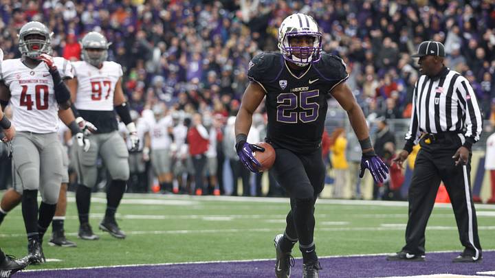 Nov 29, 2013; Seattle, WA, USA; Washington Huskies running back Bishop Sankey (25) rushes for a touchdown against the Washington State Cougars during the second half at Husky Stadium. Mandatory Credit: Joe Nicholson-Imagn Images