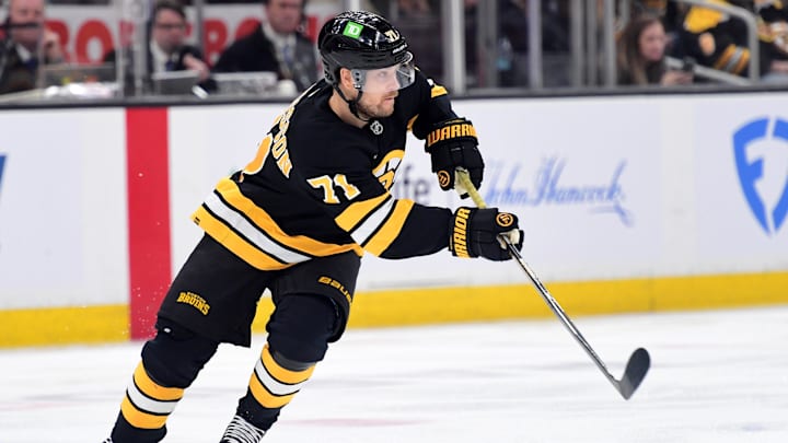 Apr 14, 2026; Boston, Massachusetts, USA; Boston Bruins left wing Viktor Arvidsson (71) passes the puck during the second period against the New Jersey Devils at TD Garden. Mandatory Credit: Bob DeChiara-Imagn Images