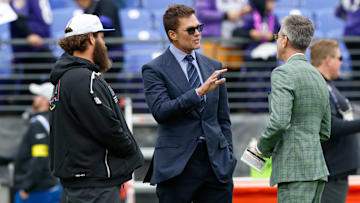 Oct 12, 2025; Baltimore, Maryland, USA; Fox Sports announcer Tom Brady looks on before the game between the Baltimore Ravens and the Los Angeles Rams at M&T Bank Stadium. Mandatory Credit: Peter Casey-Imagn Images