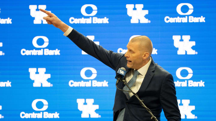 University of Kentucky’s new men’s basketball coach Mark Pope points to the championship banners as he speaks about the victories he will soon be adding to display.