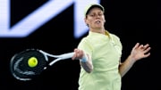 Jan 18, 2025; Melbourne, Victoria, Australia; Jannik Sinner of Italy hits a forehand during his match against Marcos Giron of United States of America in the third round of the men's singles at the 2025 Australian Open at Melbourne Park. Mandatory Credit: Mike Frey-Imagn Images