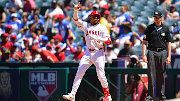 Jun 29, 2025; Anaheim, California, USA; Los Angeles Angels second baseman Christian Moore (4) reacts after hitting an RBI single against the Washington Nationals during the sixth inning at Angel Stadium. Mandatory Credit: Gary A. Vasquez-Imagn Images