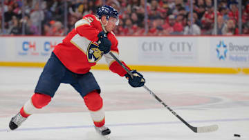 Apr 8, 2025; Sunrise, Florida, USA; Florida Panthers defenseman Nate Schmidt (88) shoots the puck against the Toronto Maple Leafs during the second period at Amerant Bank Arena. Mandatory Credit: Sam Navarro-Imagn Images