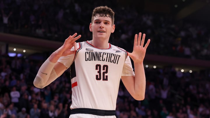Mar 16, 2024; New York City, NY, USA; Connecticut Huskies center Donovan Clingan (32) reacts during the second half against the Marquette Golden Eagles at Madison Square Garden. Mandatory Credit: Brad Penner-USA TODAY Sports