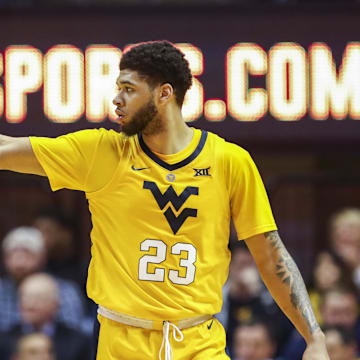 Feb 2, 2019; Morgantown, WV, USA; West Virginia Mountaineers forward Esa Ahmad (23) celebrates after a score during the second half against the Oklahoma Sooners at WVU Coliseum. 